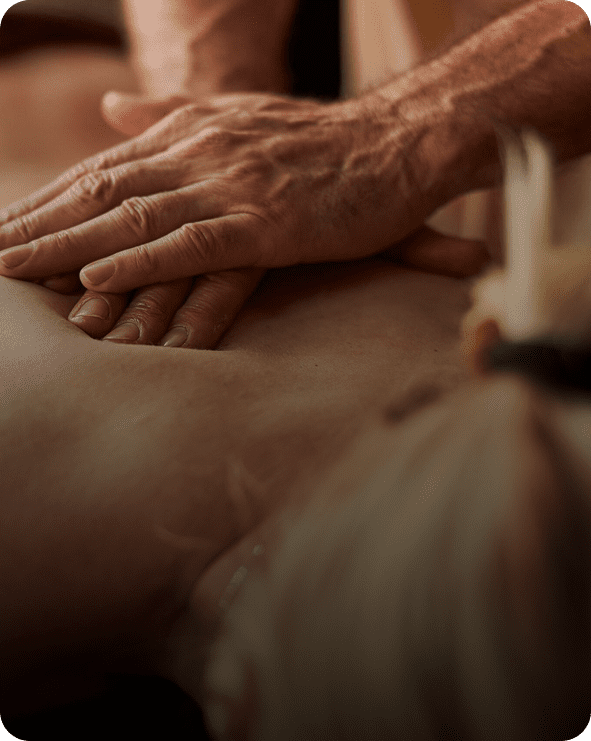 Therapist hands giving relaxing back massage