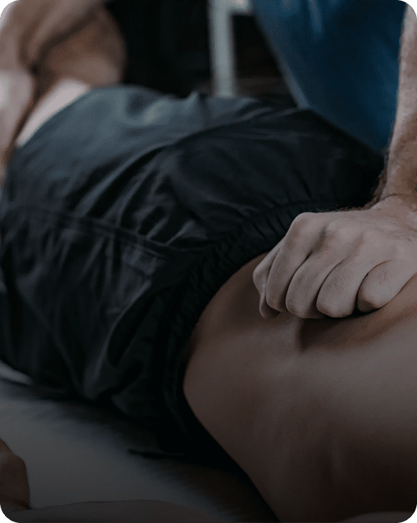 Therapist performing deep tissue back massage